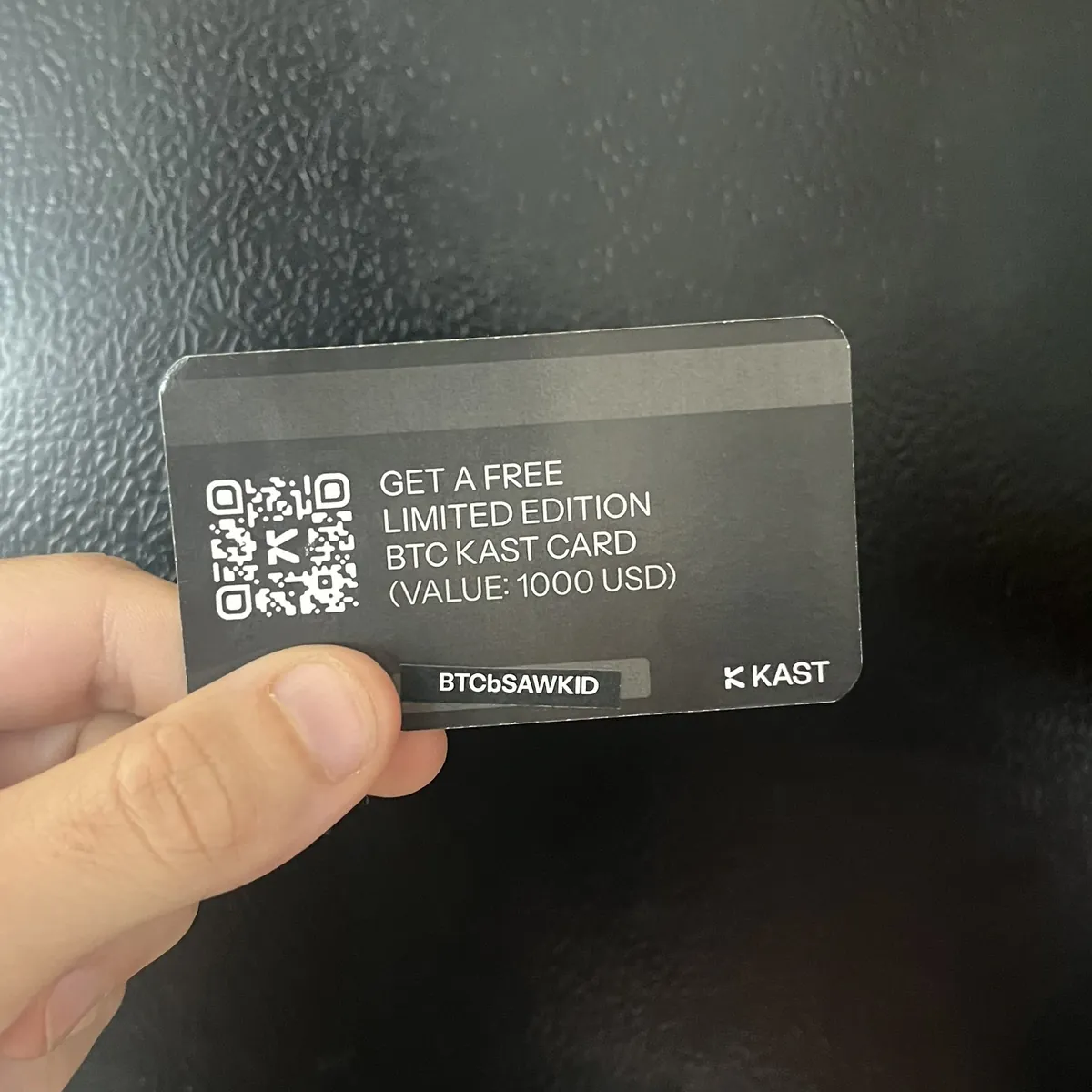 Printed KAST unlock code card for a pre-release Bitcoin card, 2025