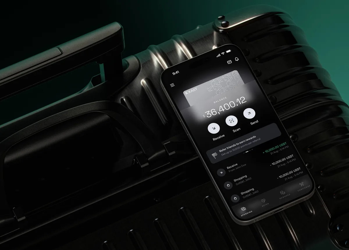 KAST app balance on a phone lying on a suitcase