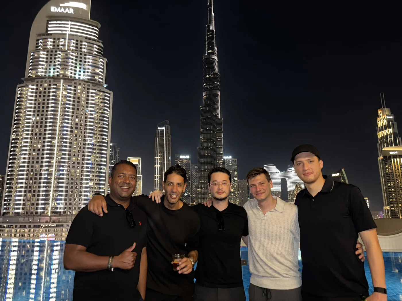 KAST team in Dubai with the Burj Khalifa behind, TOKEN2049 2025