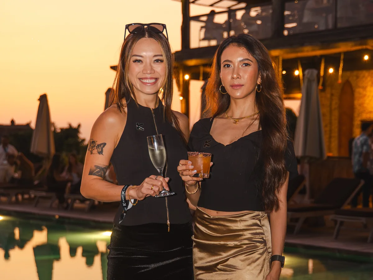 Guests at a Bali beach club at sunset during a KAST evening