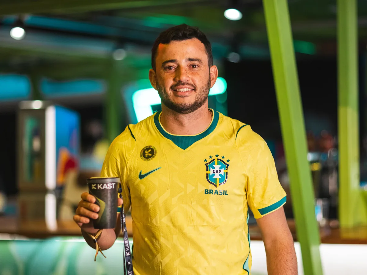 Brazil fan with a KAST cup at a World Cup watch party