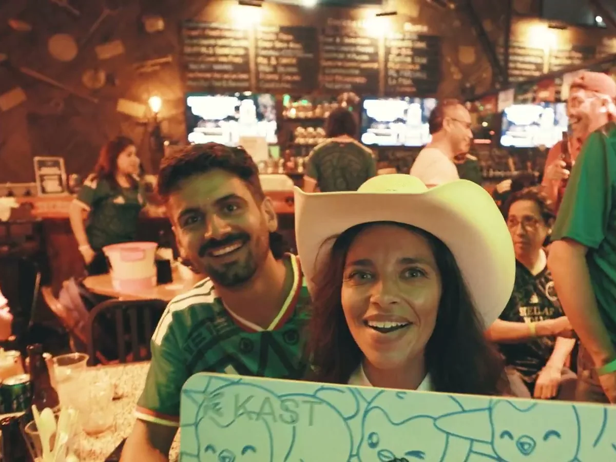 Mexico fans with a KAST board at a Matchday watch party