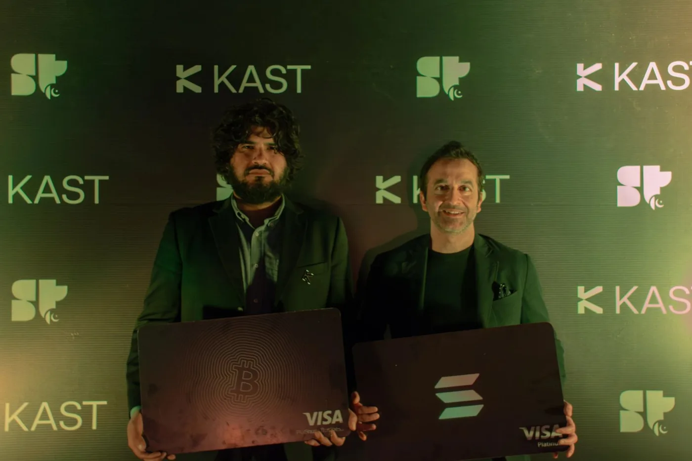 KAST and Superteam Pakistan hosts holding giant KAST Visa cards at the iftar in Lahore, February 2026