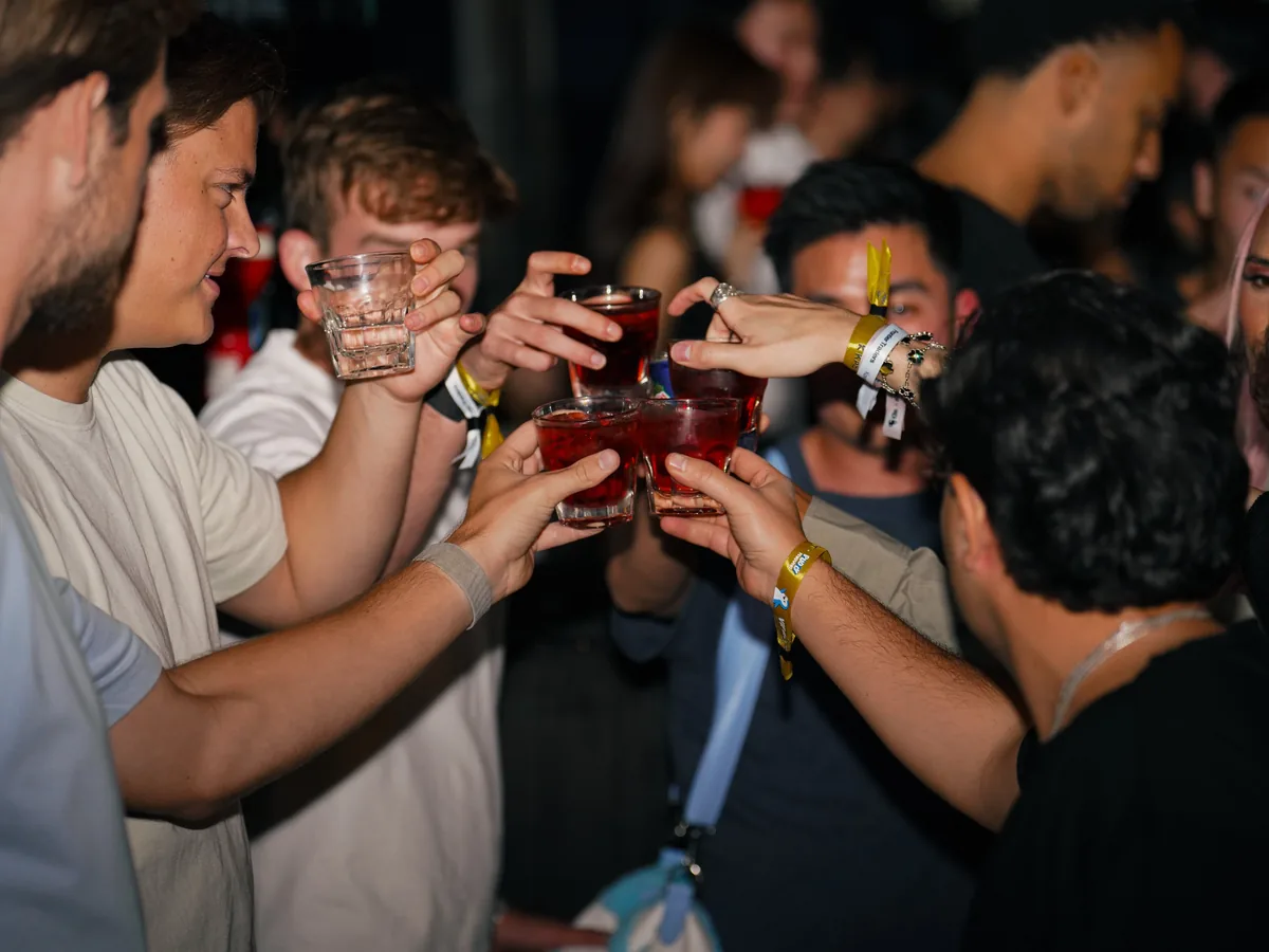 Guests toasting at the KAST Pengu Card Party in Seoul
