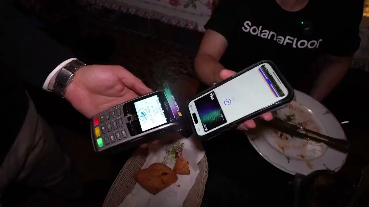 Tapping a phone to pay at a restaurant in Istanbul