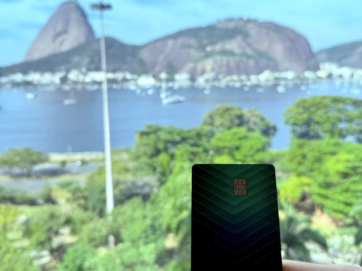 KAST Solana card held up in front of Sugarloaf Mountain, Rio de Janeiro