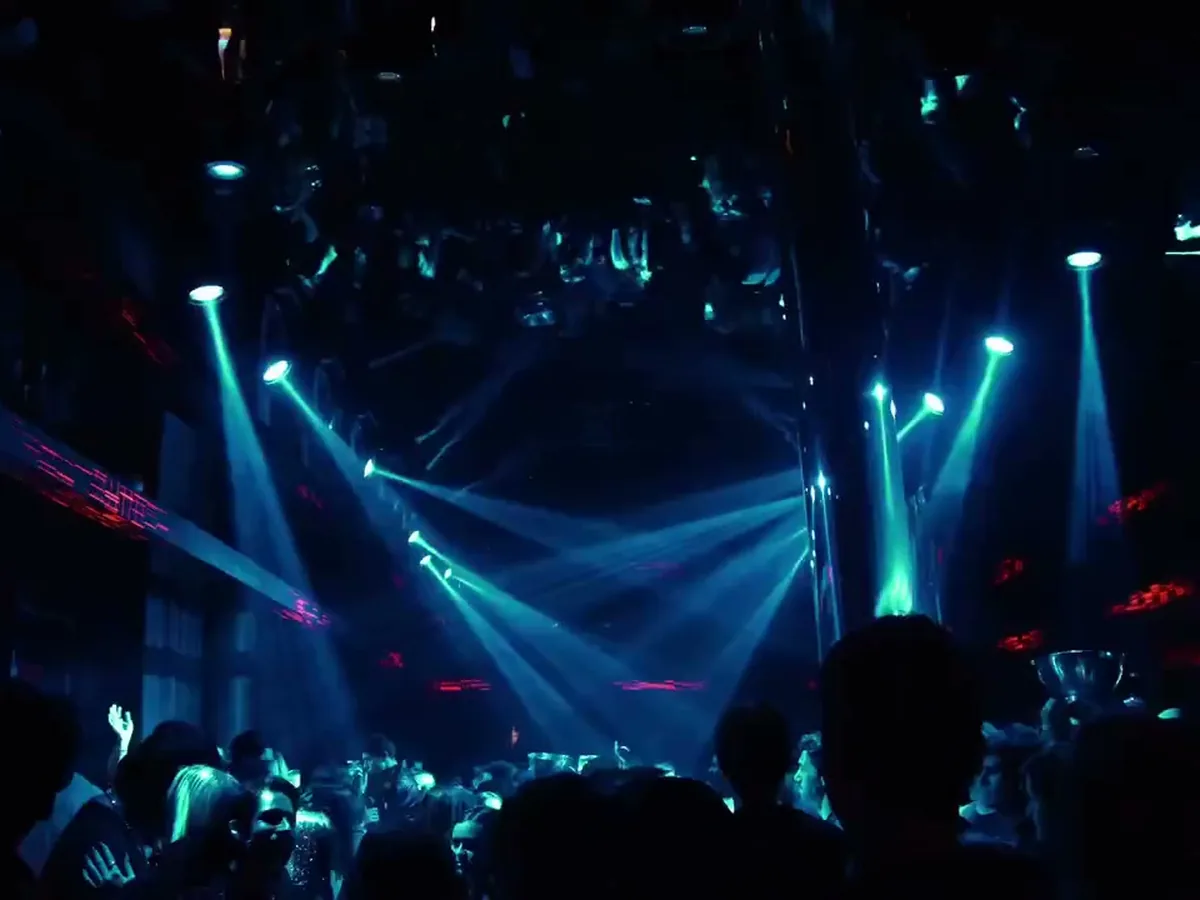Crowd under blue lights at the KAST Solid Gold Party in Buenos Aires