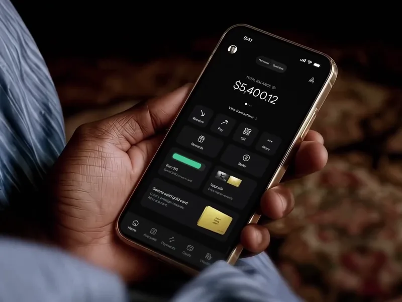 Hands holding a phone with the KAST app balance